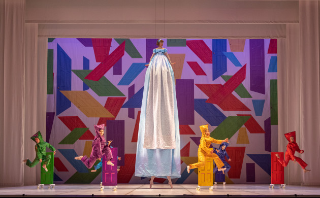 Carina Roberts as Alice with child guest artists as little doors.