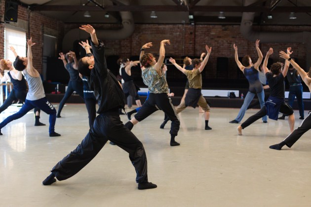 Kuindersma (front) rehearsing with dancers. Photo by Daniel Pearce.