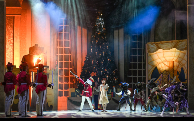 Oscar Valdes as the Nutcracker and Carina Roberts as Clara with dancers of the WA Ballet.