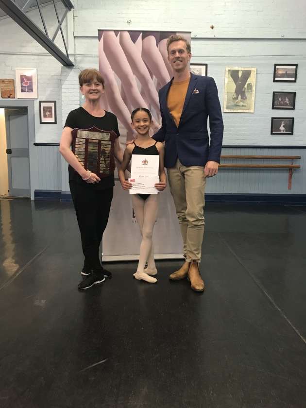 Overall winner Ramita Coldrey with teacher Shayne Davies and Adam Bull.