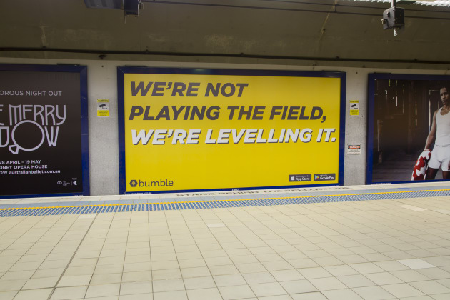 "We're not playing the field, we're leveling it," reads one of the Bumble billboards