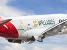Qantas jumps back into loyalty bed with Woolworths