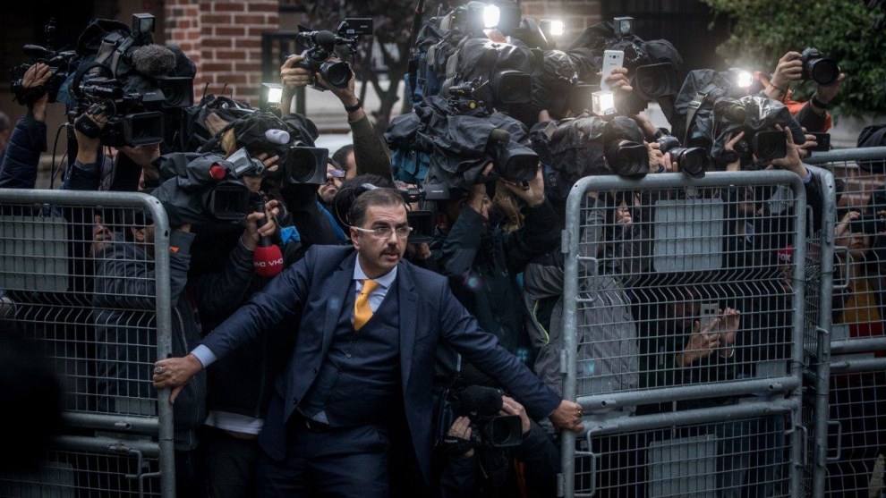 World Press Photo of the Year Nominee. The Disappearance of Jamal Kashoggi. An unidentified man tries to hold back the press on 15 October, as Saudi investigators arrive at the Saudi Arabian Consulate in Istanbul, Turkey, amid a growing international backlash to the disappearance of journalist Jamal Khashoggi. &copy; Chris McGrath, Getty Images.