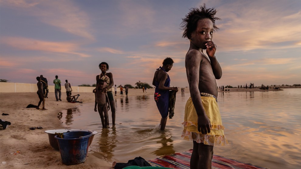 Stefano Pensotti, Timbuktu, Mali. In the last light of day the inhabitants of Timbuktu wash their clothes and take a shower in the port of Kabara. Canon EOS 5D MkII, EF24mm f/1.4L USM lens, f6.3, 1/40s, ISO 400.