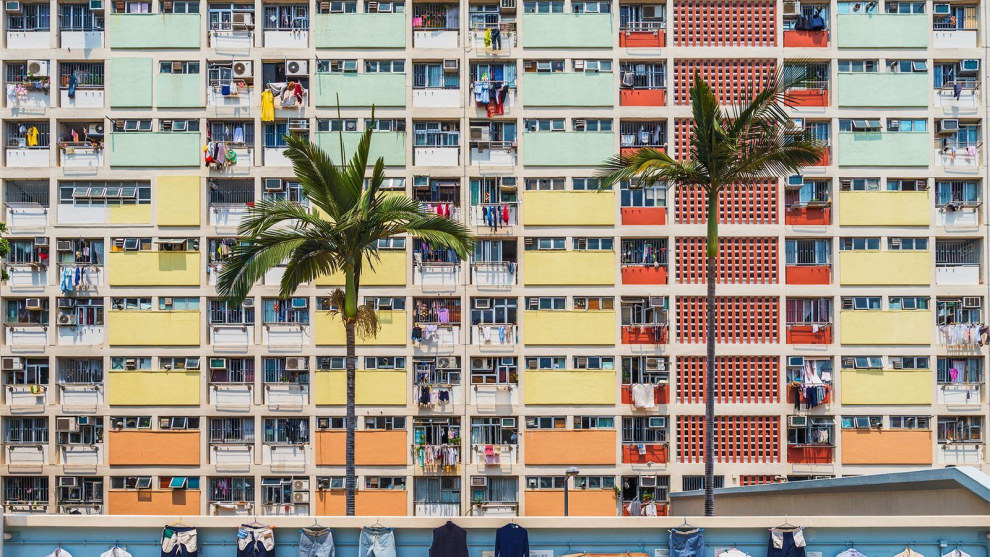 Choi Hung estate, literally meaning "the Village of Rainbow" in Cantonese, is a neighborhood with very vivid paint job in Kowloon, Hong Kong. Look how the drying laundry resembled Emojis!