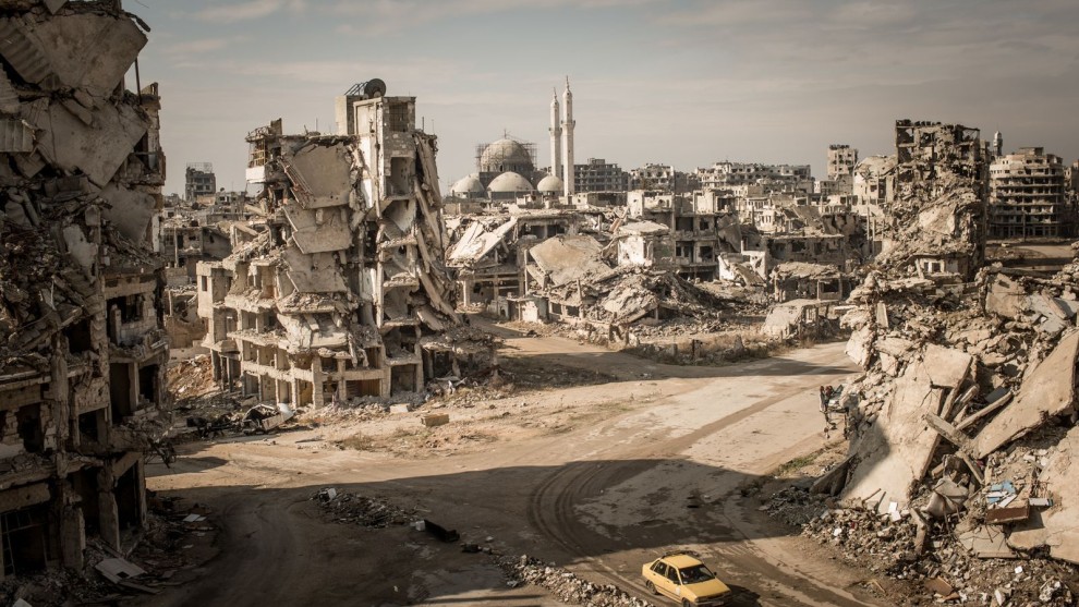 3rd Place in Places. Photograph and caption by Christian Werner / 2018 National Geographic Photo Contest. While on assignment for Der Spiegel, we made a road trip through Syria to document the current situation in major cities. When I first entered the Khalidiya district in Homs, I was shocked. I hadn&rsquo;t seen such large-scale destruction before, and I had been to many destroyed cities. The area around the Khalidiya district was extremely quiet. No city sounds, cars&mdash;nothing. Only the chirping of swallows and the wind.

We walked down the streets of Khalidiya, but the destruction was so large scale that you couldn&rsquo;t have the big picture from the point of view on the street&mdash;you could only manage it with a view from above. To make this image, I asked a Syrian soldier in charge of the area if I could climb onto a ruin. The soldier agreed, allowing me to climb at my own risk. I climbed up the ruins of a former house&mdash;which was full of improvised explosive devices&mdash;and took the picture.