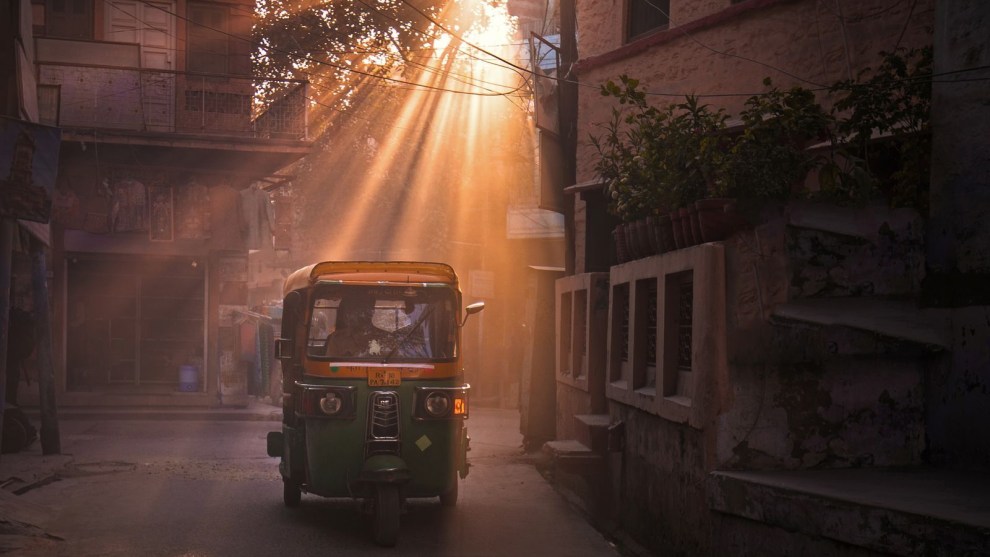 Shot in Jaipur during the "Golden Hours" of the day, it is easy to see why locals call this the "Pink City of India" - the soft rays cast from the late afternoon sun permeates every corner of the city, bringing out all shades of red and pink from within. As a taxi pierces through the thick fog of dust particles left behind by other passing cars, it gives off a mesmerising, yet mysterious feel, to this shot.