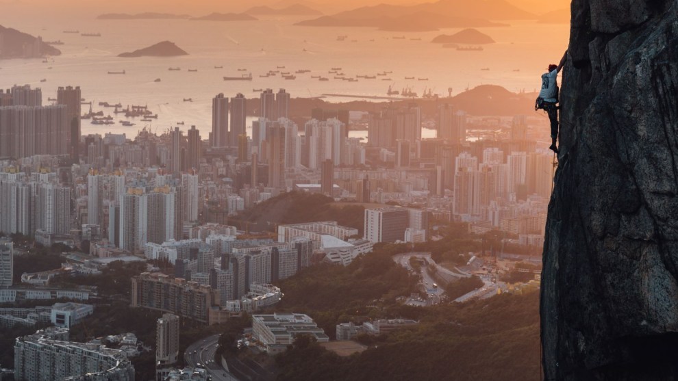 Rock climbing places around the world. Some are in the forest or in remote mountains. Hong Kong's Lion Rock is in the center of the city. This is a unique Hong Kong.
