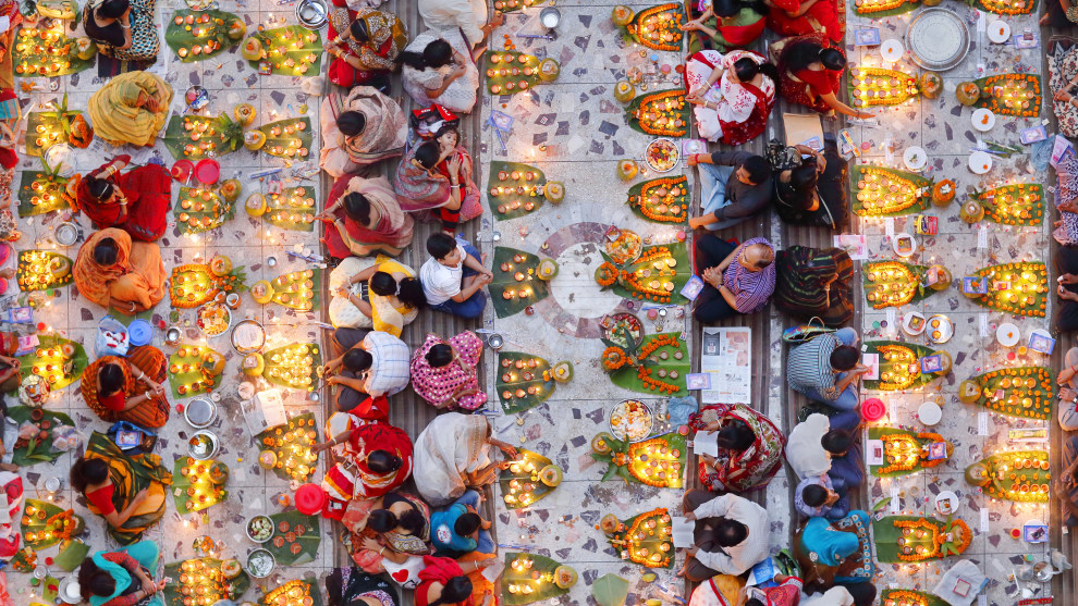 Overall Winner: Pink Lady&reg; Food Photographer of the Year: Noor Ahmed Gelal, Bangladesh. Praying with Food. Breaking the fast in congregation. A section of the Hindu community is preparing to break the day-long fast in one of the local temples at Swamibag, Dhaka, Bangladesh. They believe their fasting will redeem their sins.