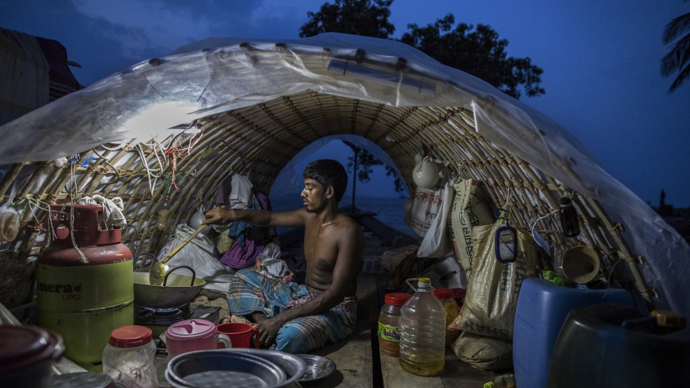 World Food Programme Food for Life. Probal Rashid, Bangladesh.	A Fisherman's Life. Lokman Miah (30) is a fisherman cooking on a fishing boat in Bhola, Bangladesh. On the Bhola Island, fisher communities live in close proximity to the river where land is cheaper. This allows them to live close to their livelihood. At the same time, this location makes them vulnerable to riverbank erosion, which, according to villagers, has been increasing in recent years.