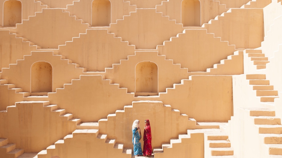 &copy; Ami Vitale. Women in a Stepwell. Manisha and Jasmin Singh pause in the Baoli, an ancient step well in a village near the city of Jaipur outside of India&rsquo;s Thar desert.