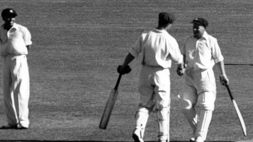 Bradman's 150th century, receiving Keith Miller's handshake.
