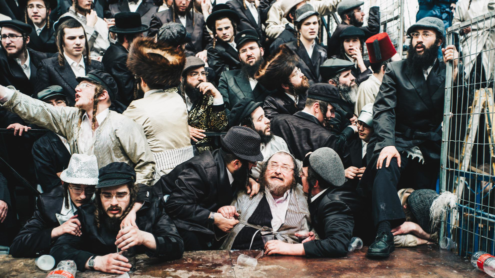 Photographer Name: Sebastien Leban, France

"This photo depicts a banquet seen in a religious school during the Pourim celebrations in the ultra religious neighbourhood of Mea Shearim in Jerusalem on March 2, 2018. Purim commemorates the saving of the Jewish people from Haman, who was planning to kill all the Jews. This took place in the ancient Achaemenid Persian Empire."
