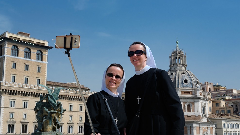 Photographer: Polly Rusyn, UK

"Rome, Italy. April 2018. I was determined to take a photograph of nuns whilst in Rome and it was on my last day that I came across these two, looking cool in their sunglasses happily taking selfies. I positioned myself in front of them, and took a couple of shots repositioning myself slightly to ensure the phone was clearly separated from the buildings in the background. I&rsquo;d convinced myself they were oblivious to my presence even though I was only a matter of feet away from them, but I was wrong! They didn&rsquo;t seem to mind though and we exchanged smiles and waves as we went our separate ways. I love the shot, as it shows nuns as being just like the rest of us when on holiday."