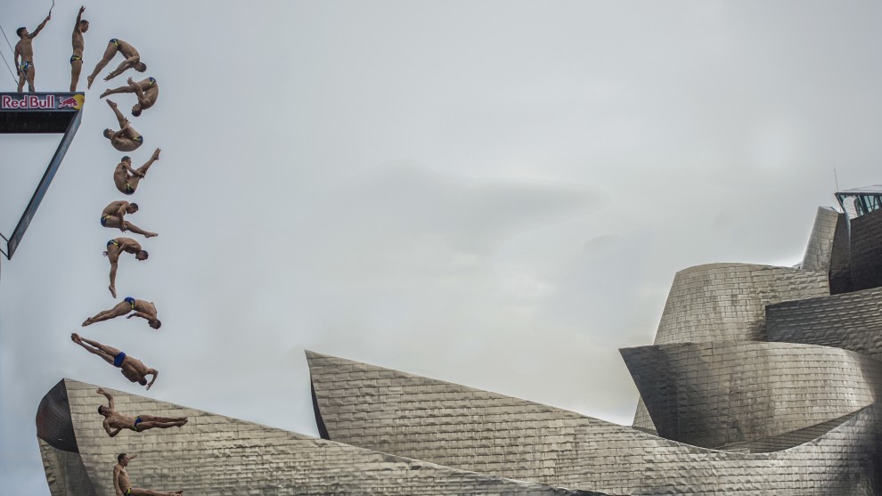 Photographer: Pedro Luis Ajuriaguerra Saiz, Spain

"The diver of the Czech Republic Michal Navr&aacute;til makes one of his jumps next to the Guggenheim Bilbao, as part of the RedBull Cliffdiving world series 2018.This image shows the sequence of the complete jump from the platform. It is an image that tells us many aspects. On the one hand, we can appreciate the camaraderie that exists between the jumpers in such a demanding and competitive competition, on the other hand, we can also perceive the interest of the athletes in registering and sharing all the unique moments, perhaps in their networks and profiles with its millions of followers, without a doubt a sample of the digital society 3.0 in which we live."