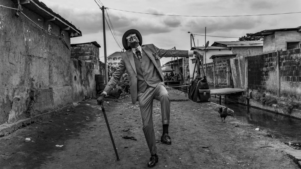 Tariq Zaidi, UK, Highly commended, faces, people, cultures portfolio. Brazzaville, Republic of the Congo. Elie, 45, struts his stuff in the streets of Brazzaville. He has been a Sapeur for 35
years and his elaborate outfits bring joy to himself and his community. Canon EOS 5D Mk III, 24-70mm lens, f8, 1/800s, ISO 800.