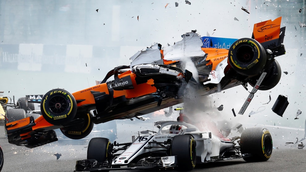 Copyright: &copy; Francois Lenoir, Belgium, Shortlist, Open, Motion (Open competition), 2019 Sony World Photography Awards. McLaren's Fernando Alonso and Sauber's Charles Leclerc crash at the first corner during the Belgian Grand Prix in Spa-Francorchamps, Belgium, August 26, 2018.