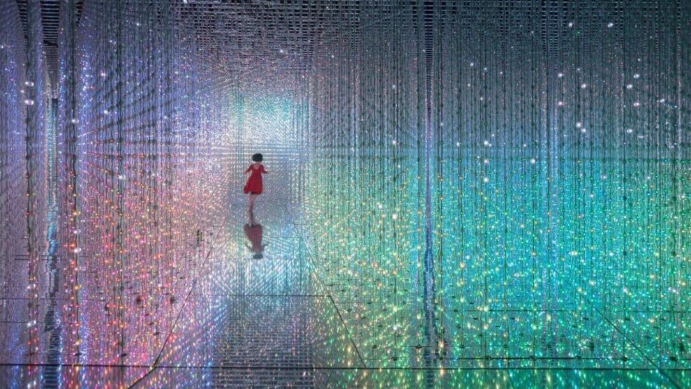 THE GIRL WHO LEAPT THROUGH TIME. The light illusion is created by artwork that uses an accumulation of light points to create a sculptural body. I saw a little girl in red dress running around the space. Luckily, she ran out again at the right moment&mdash;I found this is called &ldquo;the decisive moment.&rdquo; I couldn't wait to press the shutter as the lights were perfectly aligned to create a beautiful moment&mdash;like a girl crossing a time tunnel. Credit: DANIEL CHEUNG