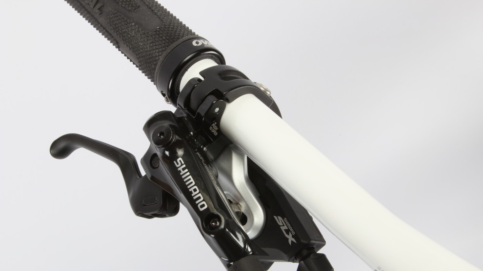 <p>The SLX shifters fit directly to the brake levers via i-Spec mounts for a tidier handlebar setup.</p>