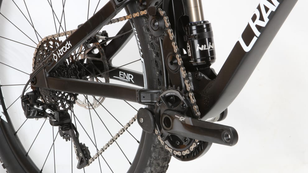 Certainly a lot going on around the ENR&rsquo;s drivetrain. The idler is actually mounted to a moving suspension component and the lower guide is required to maintain sufficient chain engagement.
