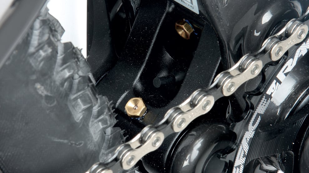 Tucked away on the lower link, the grease ports make pivot servicing a little easier&mdash;just make sure you wipe them clean before hitting it with the grease gun.