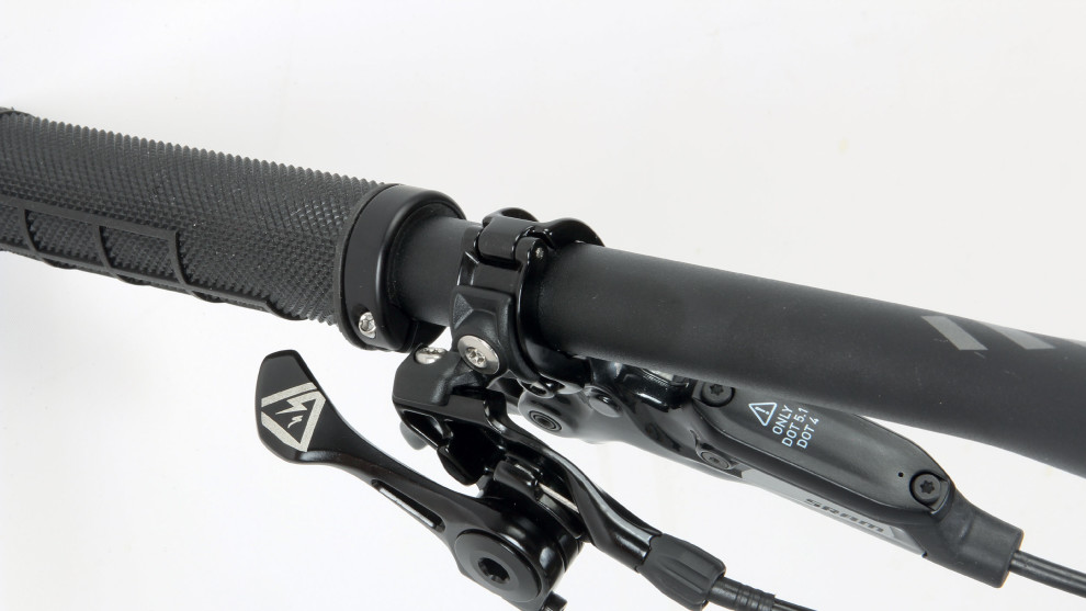 Their own-branded dropper post remote is under the bar on the left hand side - right where you want it on a 1X equipped bike.