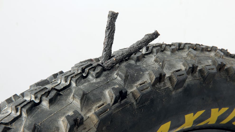With the hole plugged, you can trim the ends off or leave them in place while you continue your ride.