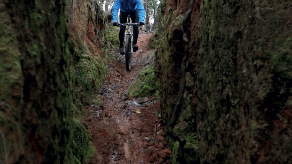 Dropping into the dirt chute on Carcass Canyon.
