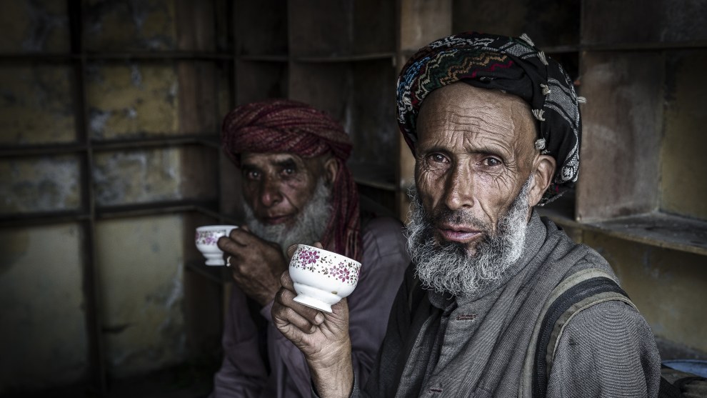 Men at a teashop, Ladakh, India. These two men, like me, were stuck in a massive traffic jam on the road from Leh in Ladakh to Srinagar in Kashmir. I saw them as I walked by but instead of abruptly appearing in front of them with my camera, I ordered a cup of tea and acknowledged them as I sat down. I didn&rsquo;t really want tea, but it seemed like a good way to break the ice. Whether it made any difference or not I&rsquo;ll never know, but this remains one of my favourite portraits. Canon 1D X, Canon 24-70mm lens @ 50mm,&nbsp;
1/125 @ f5.6, ISO 1000.