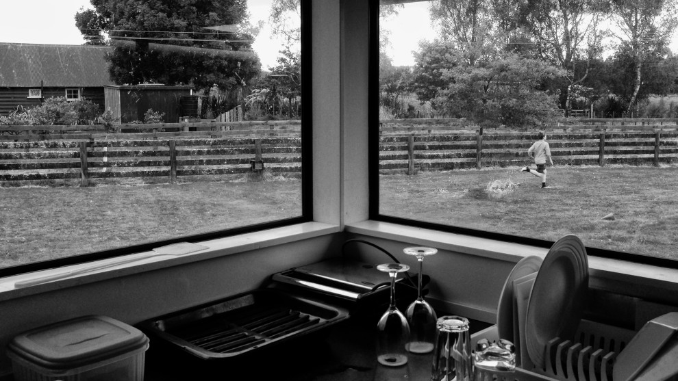 For parents living with a child with ADHD, frustrations can run high. Keeping a child on task is a daily and constant battle. Simple tasks like drying the dishes are often replaced by the importance of running in the rain. Fuji X100T. 1/200s @ f8, ISO 100.