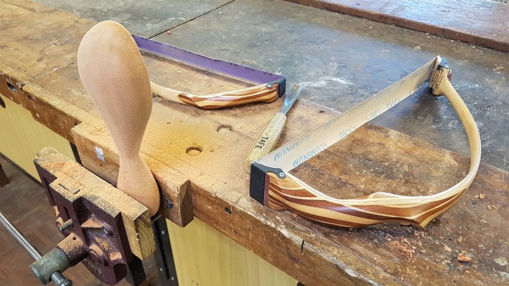 Using an original John Van Der Kolk designed bow sander to finish off some carved spoons