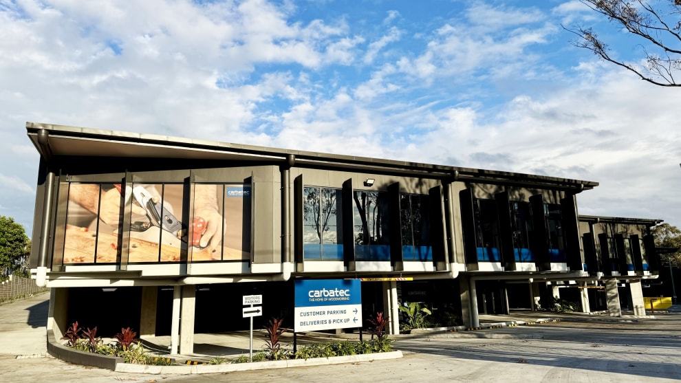 Outside the new Brisbane Carbatec premises; underground parking and an integrated display area with adjacent warehousing.