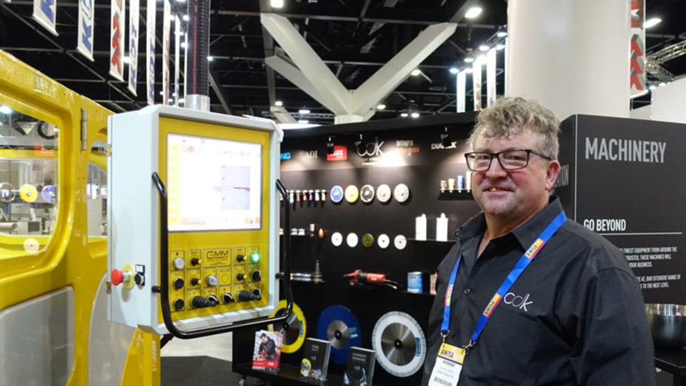 Ian McConnell at the digital helm of CDK Stone's pin-point accuracy stone sawing display unit.