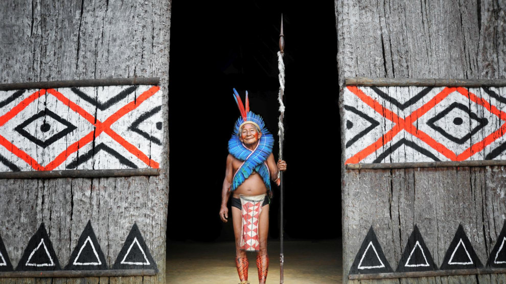 Amazonian village chief in the doorway to his hut, Brazil