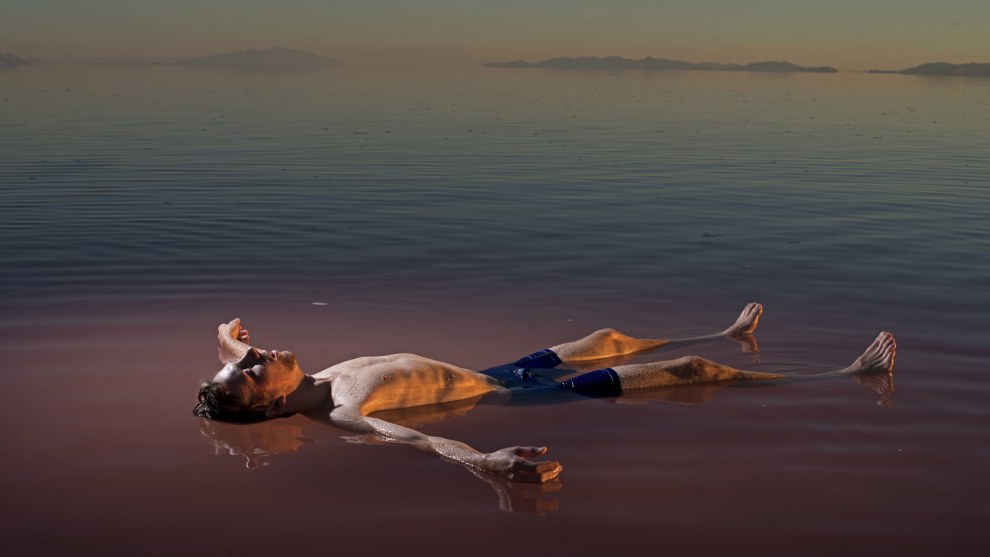 Carolyn Drake
Magnum Photos

Great Salt Lake, Utah. USA. 2016.

&ldquo;I made this picture in 2016, on the north arm of the Great Salt Lake in Utah. This part of the lake stopped receiving fresh water over 50 years ago, when the Southern Pacific Railroad built a causeway that split it in two and made the upper half incredibly saline, a haven for a red-algae called Dunaliella salina. A couple months after I was there, a bridge was constructed that allowed the water in the upper portion of the lake to start mixing with the fresher water in the lower lake, where another species of algae tints the water green.

It is a picture of man in nature that feels strikingly unnatural; the natural order is askew. Humans will force the two species of algae to meet, coexist, fight for dominance, evolve, die off.&rdquo;