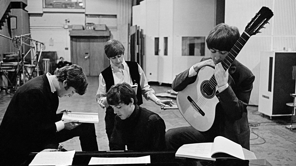 David Hurn
Magnum Photos

The Beatles in EMI Recording Studios, later renamed Abbey Road Studios. London, England.1964.

&ldquo;In 1964,  I was asked by a friend, who was about to direct the   first Beatles film A Hard Day&rsquo;s Night (Dick Lester), to photograph the film, not for press, but more from a sociological point of view. In 1963, the Beatles had gained unprecedented fame and status. It could be argued that their only next step could either be down, or to individually go in new directions. They were at crossroads
in their respective careers, and yet had already transformed the music industry. Sometimes people don&rsquo;t realize the magnitude  of their own achievements; they are clueless to the boundaries they have already crossed to get where they are. My picture shows the four members studying pages of the script for the following days of the film&rsquo;s shooting. It takes place in the Abbey Road Studio, the scene of so many of their musical triumphs.
