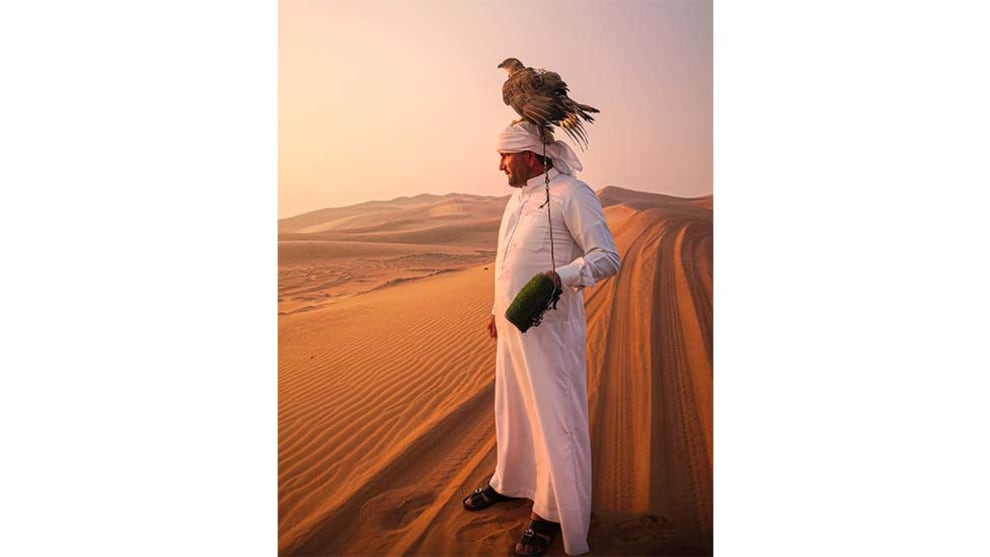 Mobile Category Winner, Tony Law, Arabic man in the desert with a falcon.