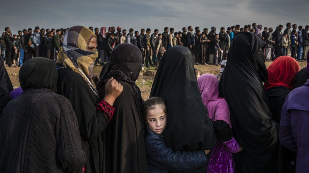 The Battle for Mosul. World Press Photo of the Year Nominee. &copy; Ivor Prickett. Civilians who had remained in west Mosul after the battle to take the city line up for aid in the Mamun neighbourhood. 
Commissioned by The New York Times.