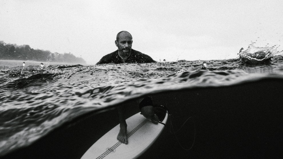 Russell Ord, Tom Carroll, Tropical Rain.	Tom Carroll portrait in the tropical rain Indonesia.