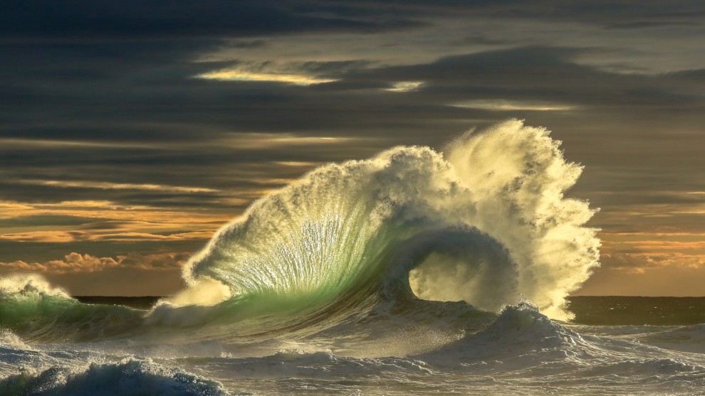 Scott Harrison, The Reward. A spot that a friend and I found that takes a bit of effort to get to. Needs the right swell and wind direction to come together for the backwash to really happen. We had been many times with ok results, but this morning everything lined up perfectly and I was rewarded with this split second moment in time under some amazing morning light