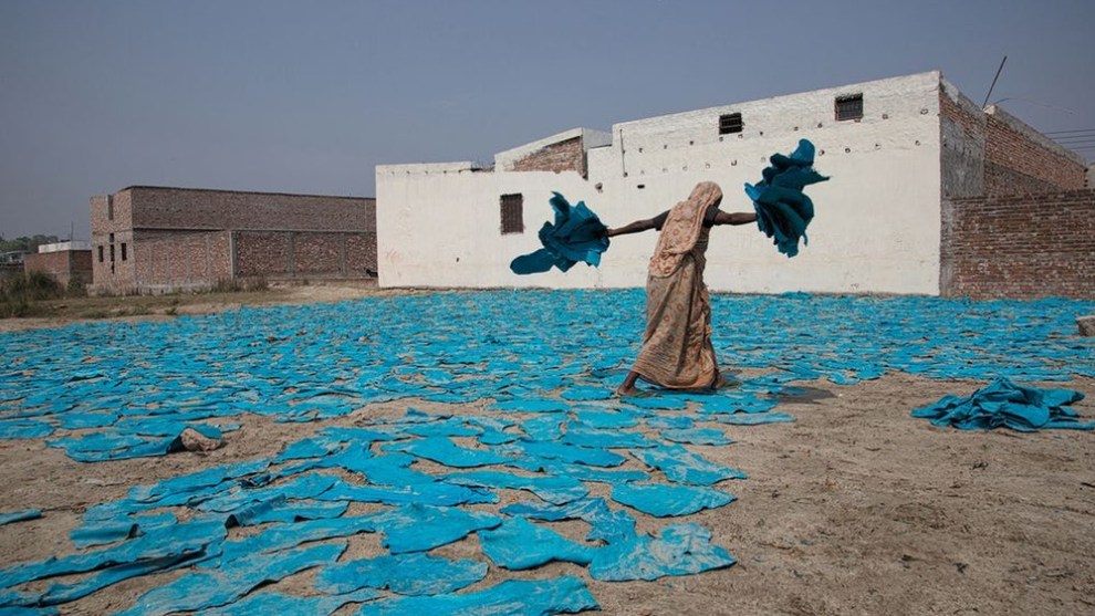 A finalist in the Travel category &ndash; a woman at work on the street near a leather factory on the outskirts of Dhaka, Bangladesh (Credit: Erberto Zani)