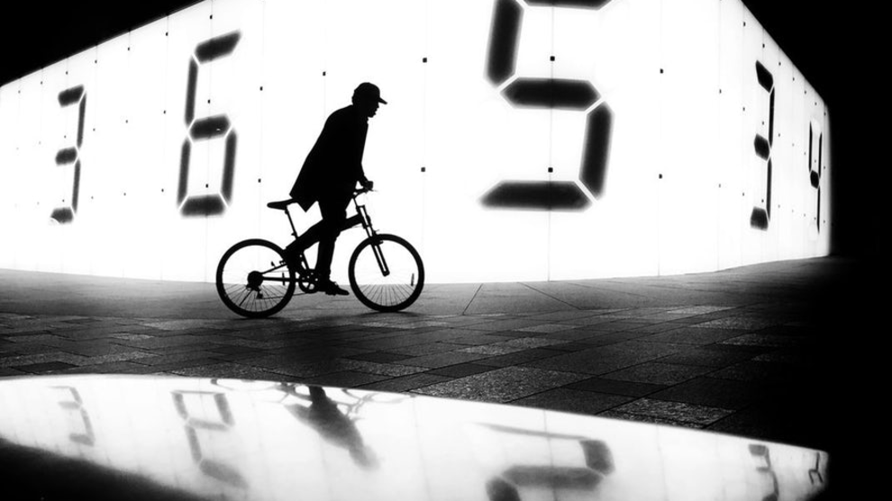 A finalist in the Mobile category &ndash; a man cycles past Tatsuo Miyajima&rsquo;s "Counter Void" installation in Tokyo (Credit: Laurence Bouchard)