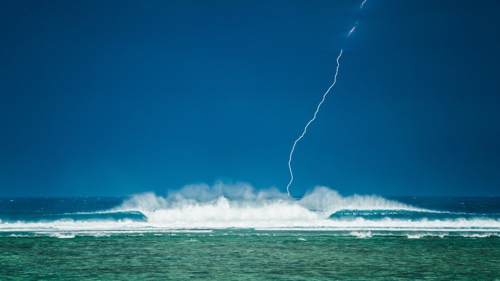 Stu Gibson, Pumping Lightning. Shooting line ups with a wild dark storm as a back drop and managed to freeze this lightning strike at 2000th of a second on the trusty D4.