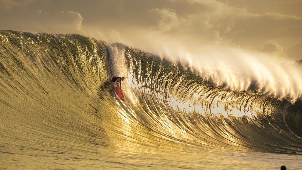 Ted Grambeau, Gold Nias. A golden moment as big wave surfer Mark Healey takes the drop on his 7'6" quiver. Surfing one of the biggest swells to ever hit Nias Island, off Sumatra in Indonesia. This image was taken by Ted Grambeau on Wednesday 25th July 2018.