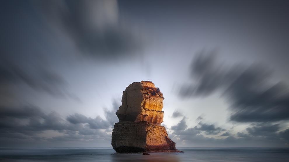I&rsquo;ve used the motion blur of the clouds to appear to spray out of the Apostle, the central anchoring part of the image. To further enhance its power in the photograph, it is the only area of strong colour and is a colour that contrasts the hue of the rest of the frame. Canon 5D Mark II, EF16-35mm f/2.8L II USM lens. 3.2s @ f8, ISO 50.