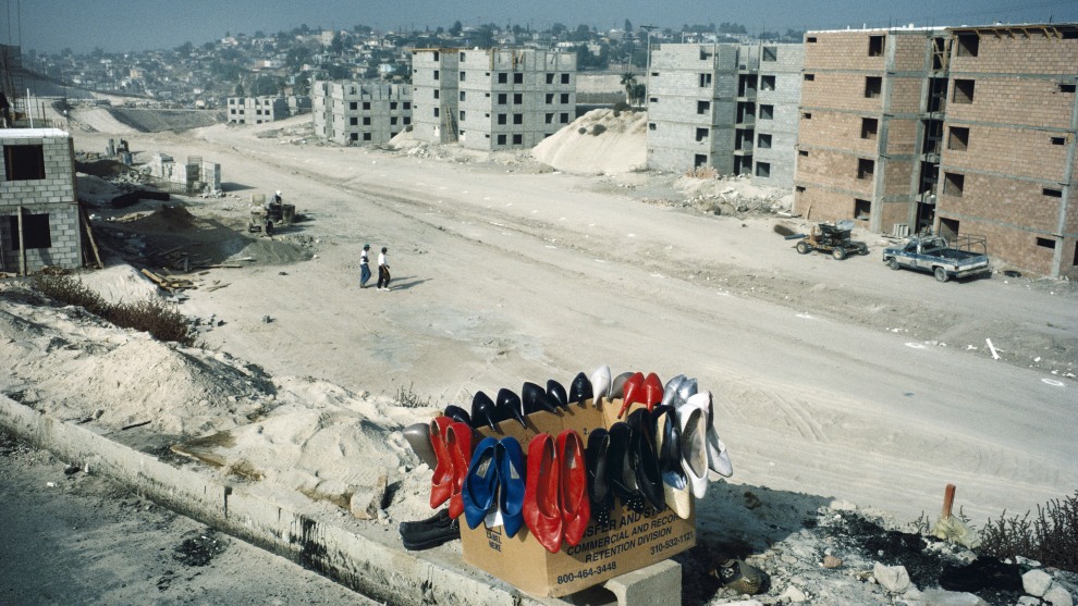 Alex Webb
Magnum Photos Tijuana, Mexico. 1995.
&ldquo;I&rsquo;ve long been fascinated by the transience and paradoxes
of the U.S.-Mexico border. Between 1975 and 2001, I crossed the border numerous times, photographing  this unique  region to try to make sense of it. Even though these two countries  were culturally worlds apart, it sometimes seemed that the border region was a kind of third country between them &ndash; 2,000 miles long and 10  miles wide, a place where two countries meet, sometimes easily, sometimes roughly, and often with
a confounding note of surrealism. Looking back, I realize that Crossings (2003), the book I made from this work, reflects the last days of a more porous border between the United States and Mexico, so different from today&rsquo;s militarized border.

In 1995, while walking through the outskirts of Tijuana,
I was surprised to find this box of brightly colored shoes,   which seemed so out of place on this dusty, isolated embankment.