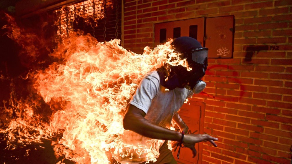 The World Press Photo of the Year. &copy; Ronaldo Schemidt.