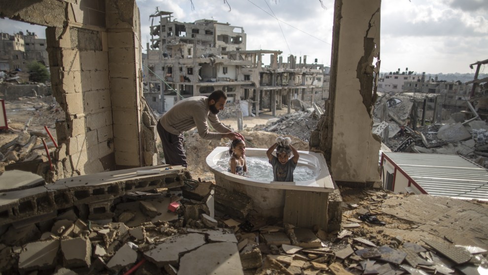 &copy; Wissam Nassar. Salem bathes his 5 year-old daughter and niece in the only surviving piece of his war-torn house in Gaza. 2015. &ldquo;This image marked a turning point in my career -- a time when my images from war were seen globally by millions. I&rsquo;ve worked in the coastal enclave of Gaza for the past fifteen years and have seen it all, living a life surrounded by war and reconstruction. But I&rsquo;ve found the most authentic images I made come from the subtler moments of reprieve. I was first inspired to begin documenting turbulence in Gaza while in college. I began my professional career covering the three Israeli-Hamas wars in 2008, 2012, and 2014 and the &lsquo;Arab Spring&rsquo;. I focus on how people want to live normal lives, spending time at parks, beaches, and coffee shops despite the rubble scattered everywhere.&rdquo;
Wissam Nassar