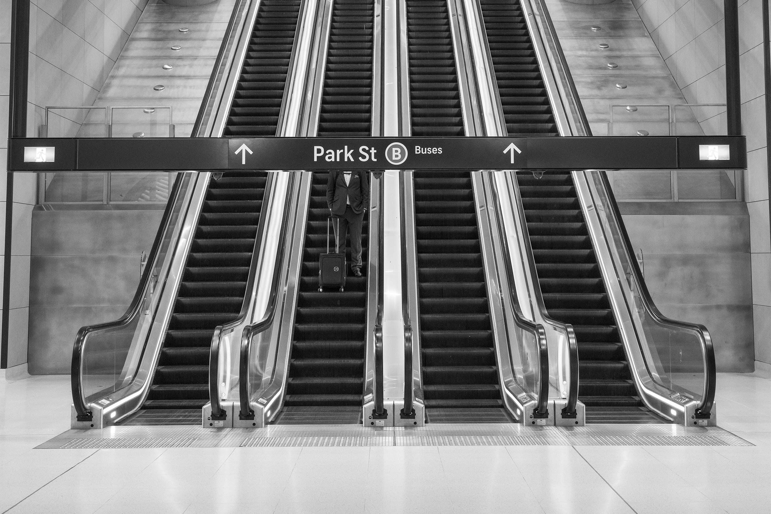 Andy Zakeli's Places category winning image transforms an everyday scene in Sydney’s Gadigal Station into something visually unexpected, with the escalator, concrete columns and signage creating a strong graphic composition. The image came from a street photography excursion with Zakeli’s TAFE students, where he was experimenting with different angles of the station’s architecture.“I took it a step further for a bit of fun and made the subject headless, almost decapitated by the signage. I like trying to add humour or strange elements to my photos purely to create interest for the viewer,” he says.