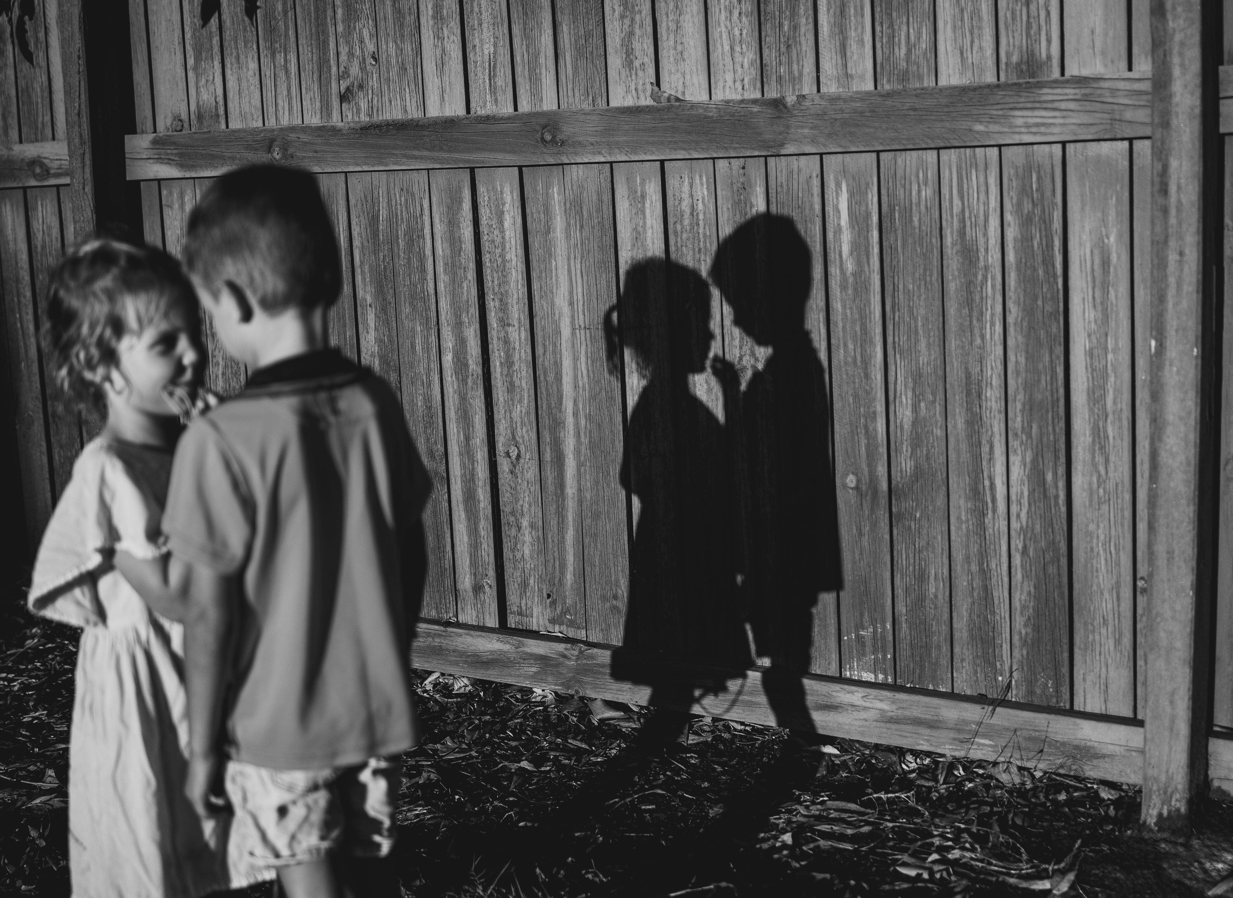 Carly Goldsmith photographed her People category winning image of her two youngest children playing together in her backyard one afternoon, unexpectedly capturing a moment of innocent beauty. “As the sun dropped lower in the sky, it cast a beautifully defined shadow across the fence. It was an unposed, ordinary moment, but when I reviewed the image later, it carried more emotional weight than I had realised at the time,” she says.
